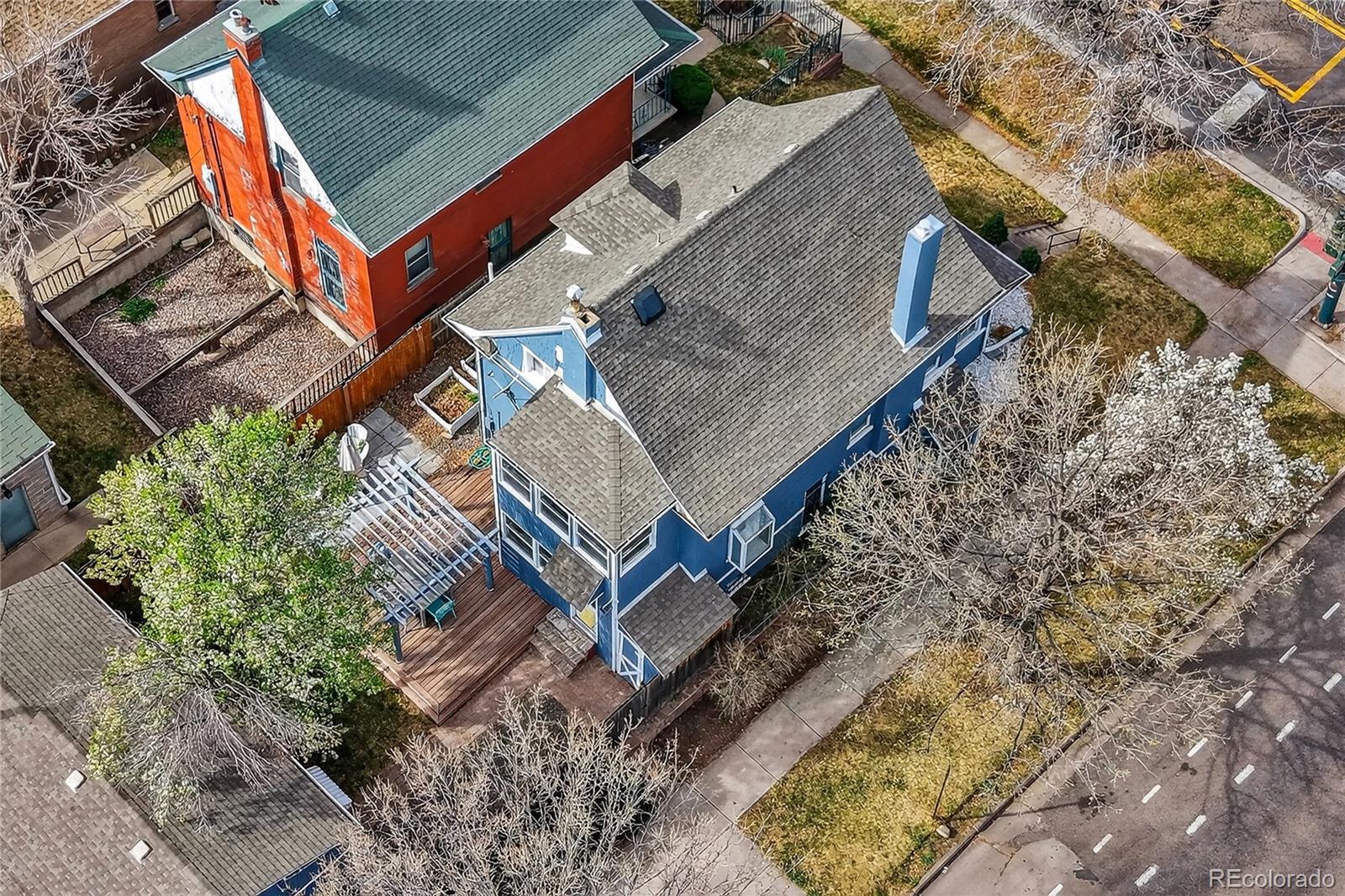 3056 York Street Denver, CO 80205 - Photo 39 of 44 an aerial view of a house with a yard