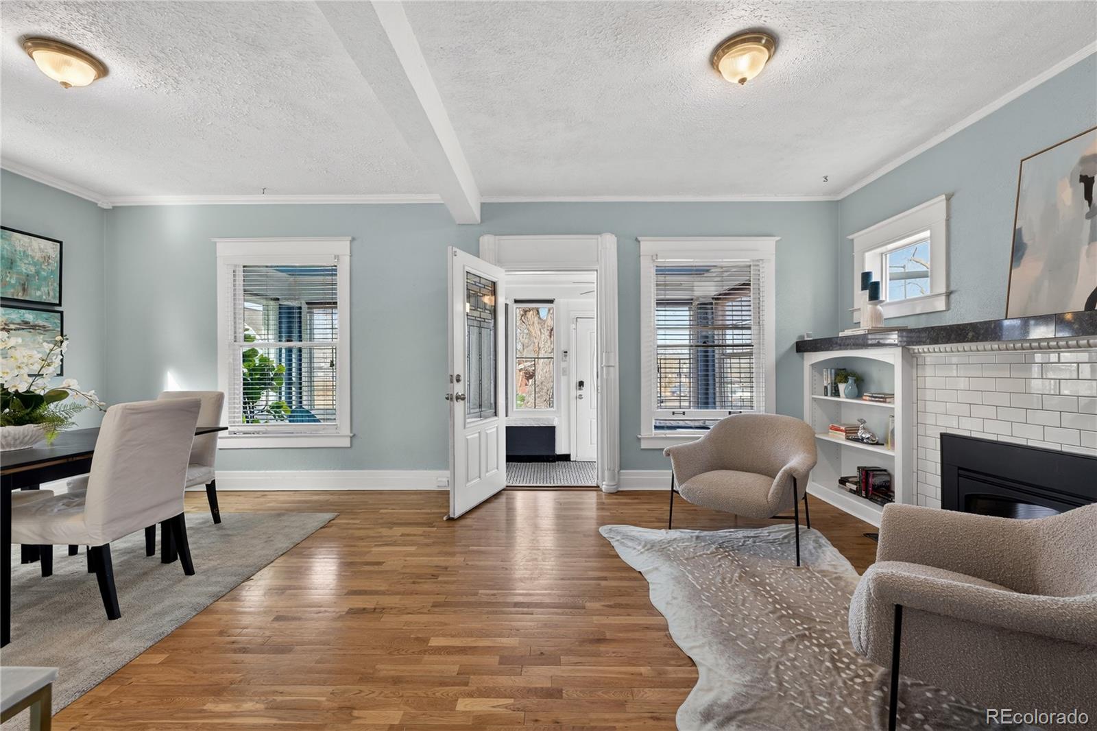 3056 York Street Denver, CO 80205 - Photo 5 of 44 a living room with furniture and a fireplace