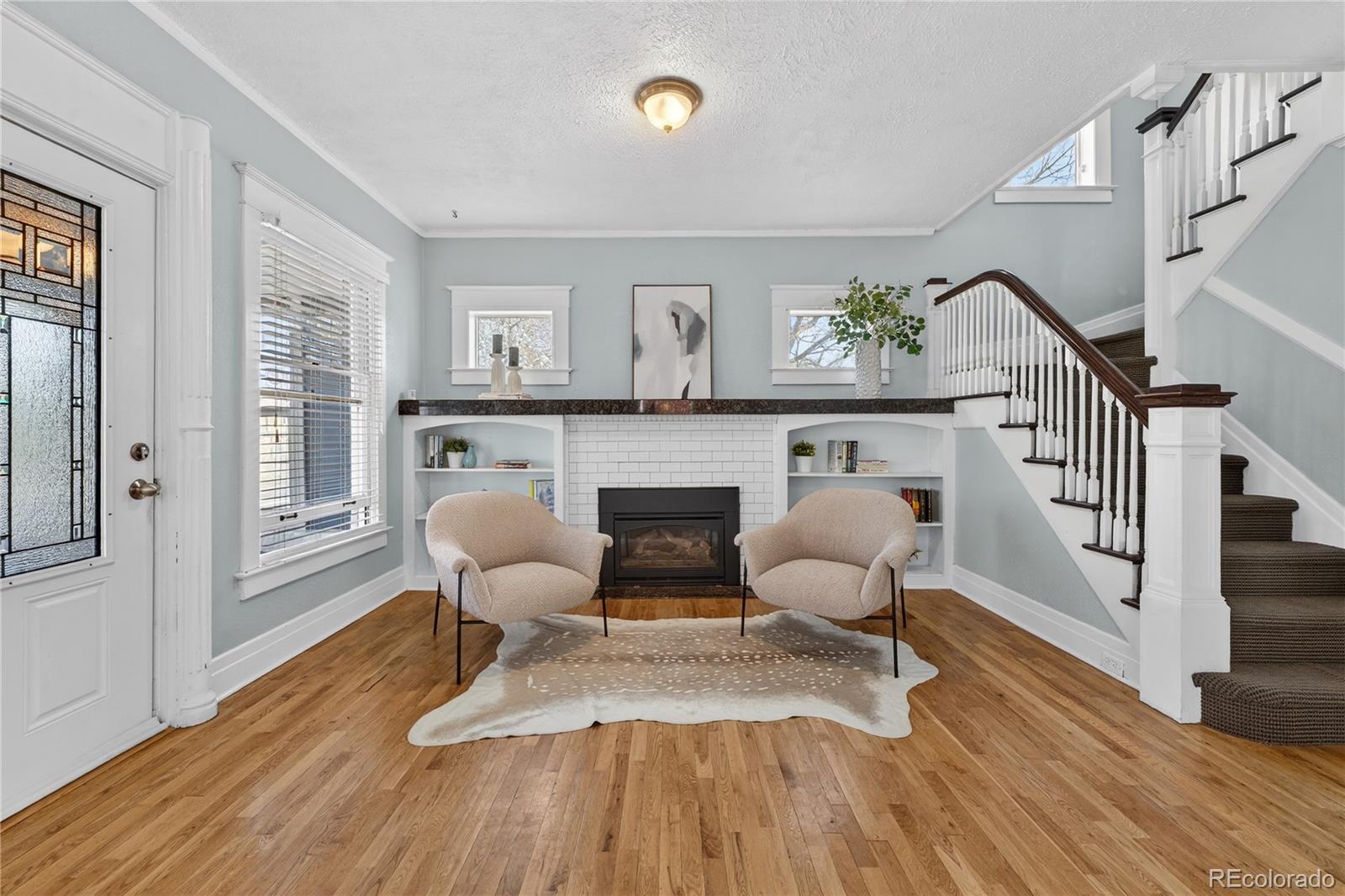 3056 York Street Denver, CO 80205 - Photo 6 of 44 a living room with furniture and a fireplace