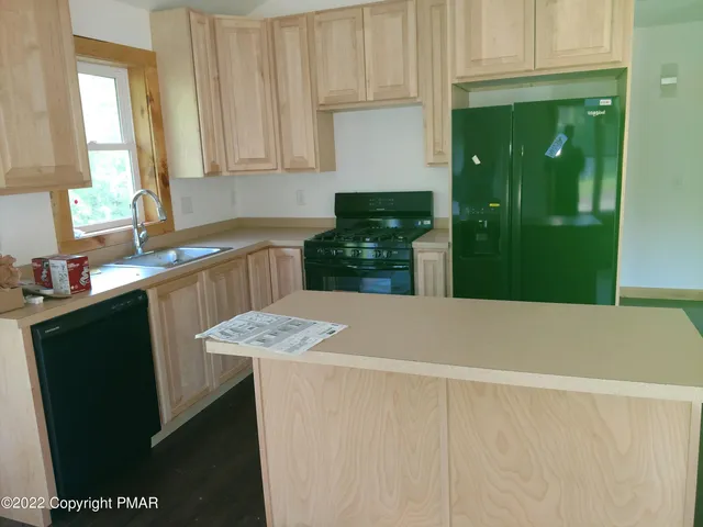 a kitchen with a sink and cabinets