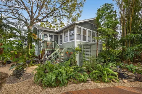 a view of a pathway both side of house
