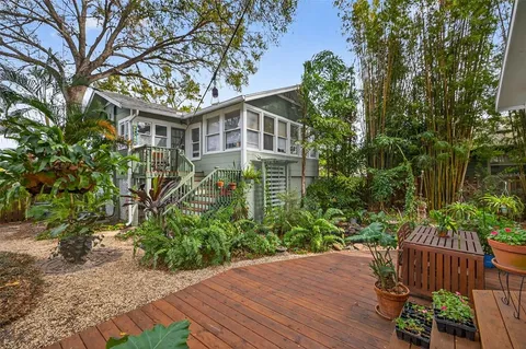 a view of a house with a small yard and plants