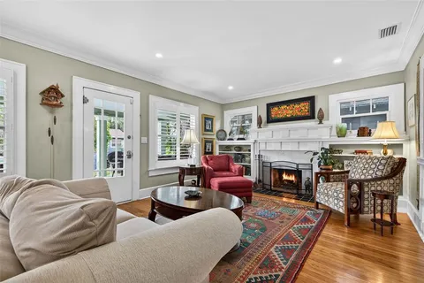 a bedroom with furniture and a fireplace