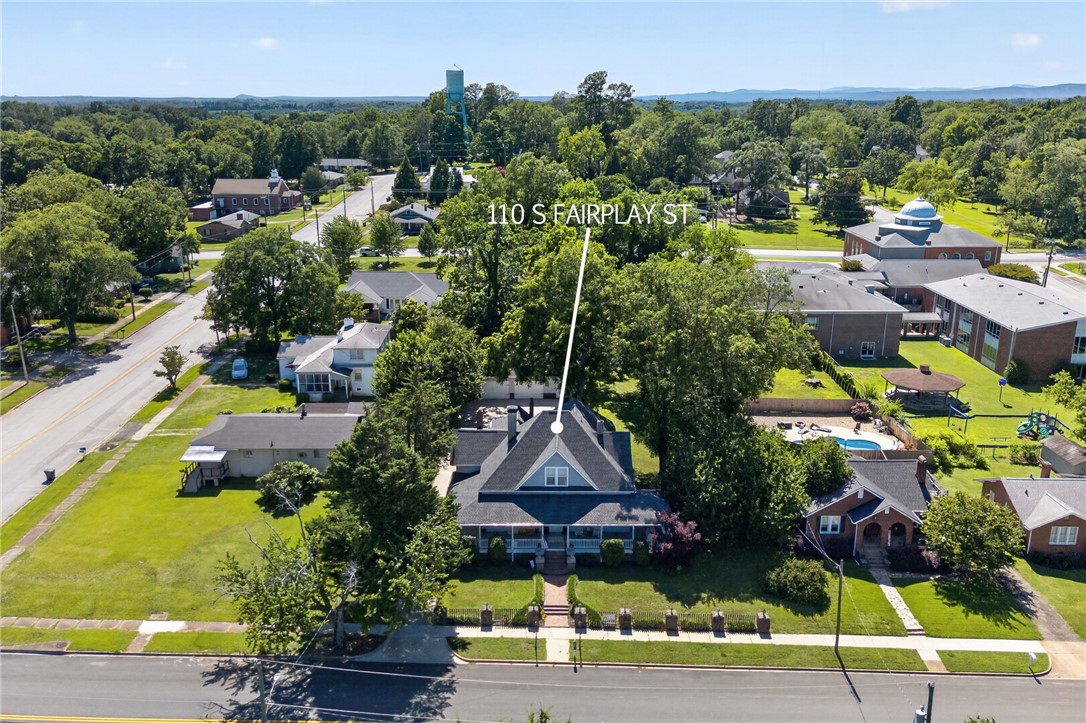 110 South Fairplay Street Seneca, SC 29678 - Photo 47 of 50 An aerial perspective reveals a charming residence nestled amidst a vibrant, tree-lined neighborhood.