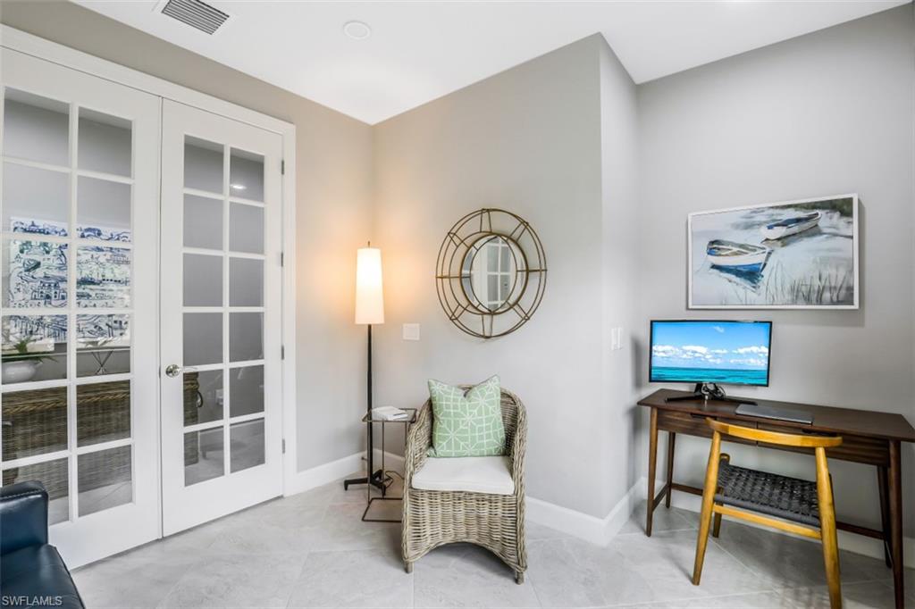 7682 Jacaranda Lane Naples, FL 34114 - Photo 12 of 30 a view of a livingroom with furniture and a window