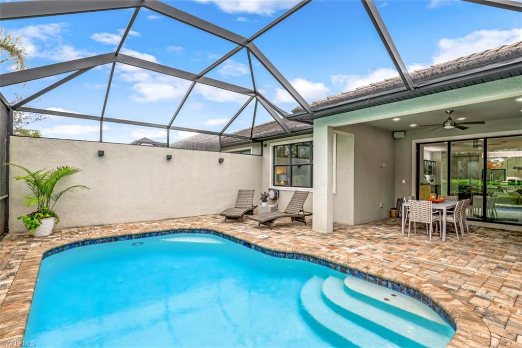 7682 Jacaranda Lane Naples, FL 34114 - Photo 16 of 30 a room with pool table and glass door