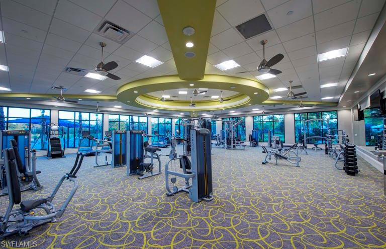 7682 Jacaranda Lane Naples, FL 34114 - Photo 21 of 30 a view of a room with gym equipment