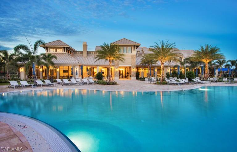 7682 Jacaranda Lane Naples, FL 34114 - Photo 23 of 30 a view of swimming pool with outdoor seating and city view