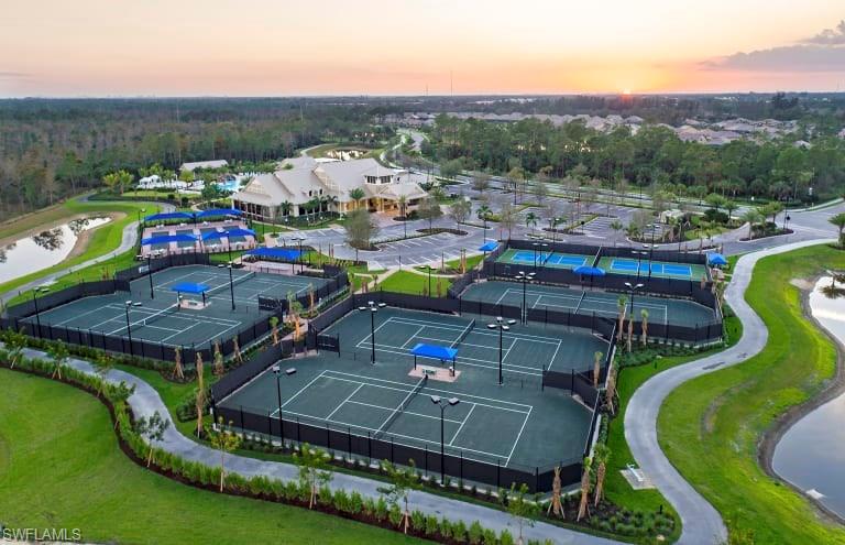 7682 Jacaranda Lane Naples, FL 34114 - Photo 29 of 30 a view of a balcony with chairs and table