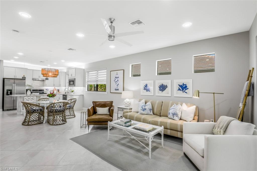 7682 Jacaranda Lane Naples, FL 34114 - Photo 6 of 30 a living room with furniture and a couch