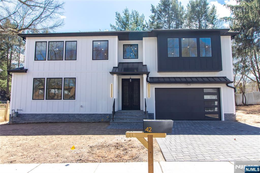 42 Harvey Street Closter, NJ 07624 - Photo 1 of 33 a front view of a house with a yard