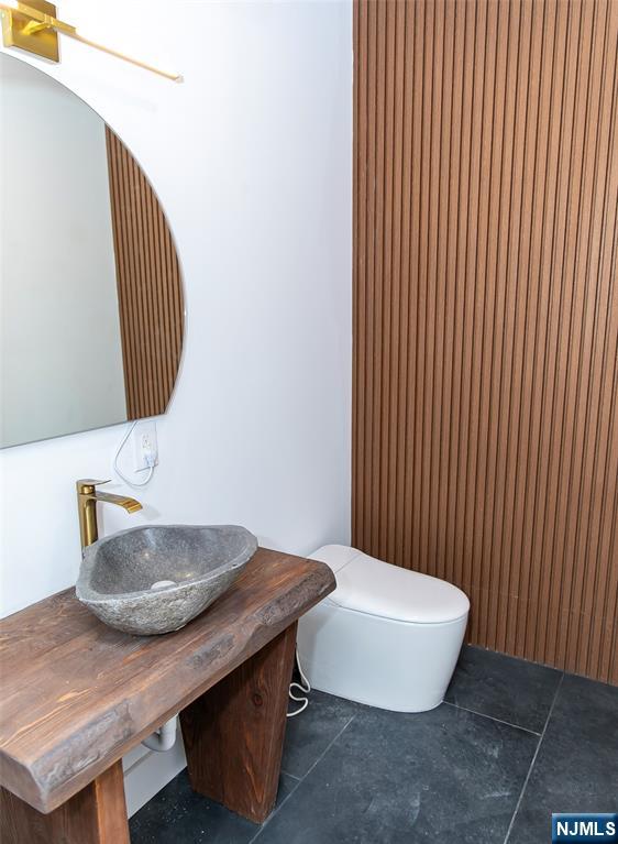 42 Harvey Street Closter, NJ 07624 - Photo 14 of 33 a bathroom with a sink and a mirror