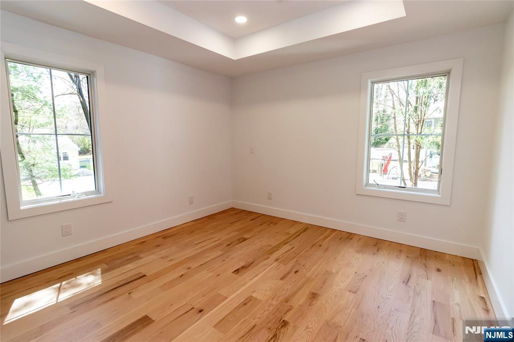 42 Harvey Street Closter, NJ 07624 - Photo 25 of 33 a view of empty room with wooden floor and fan