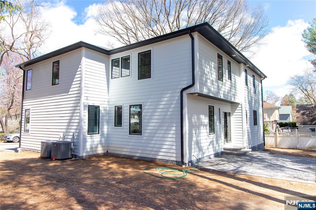 42 Harvey Street Closter, NJ 07624 - Photo 3 of 33 a view of a house with a yard