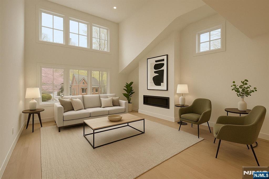 42 Harvey Street Closter, NJ 07624 - Photo 9 of 33 a living room with furniture and a fireplace