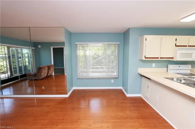 a kitchen with a stove a refrigerator and a sink