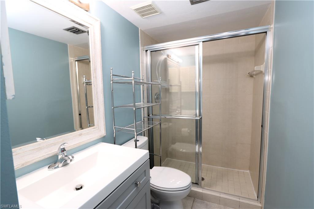 2207 San Marco Road, Unit 4104 Marco Island, FL 34145 - Photo 6 of 10 a bathroom with a sink toilet and shower