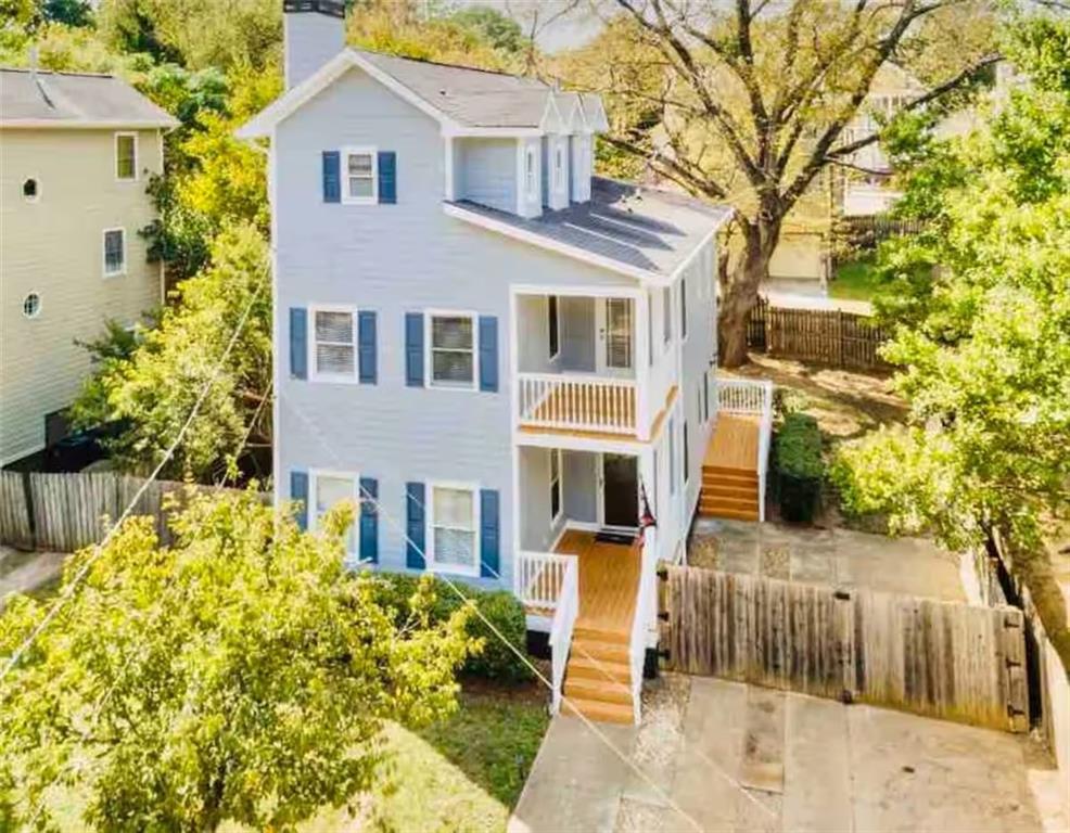 673 Windsor Street Southwest Atlanta, GA 30310 - Photo 1 of 29 a front view of a house with a yard