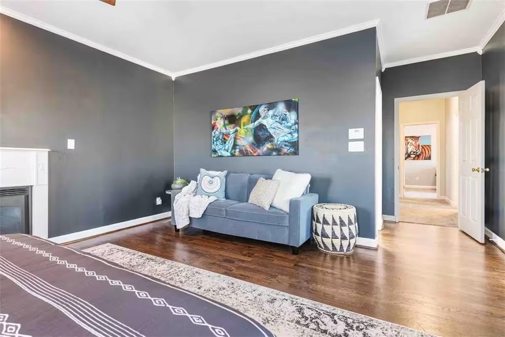673 Windsor Street Southwest Atlanta, GA 30310 - Photo 26 of 29 a living room with furniture and wooden floor