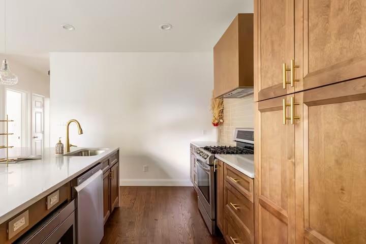 673 Windsor Street Southwest Atlanta, GA 30310 - Photo 4 of 29 a kitchen with stainless steel appliances granite countertop a sink stove and refrigerator