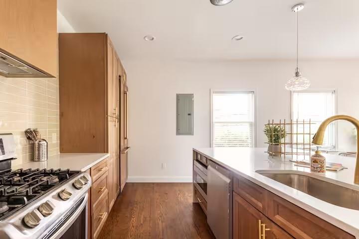 673 Windsor Street Southwest Atlanta, GA 30310 - Photo 5 of 29 a kitchen with stainless steel appliances granite countertop a sink stove and refrigerator