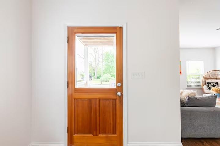 673 Windsor Street Southwest Atlanta, GA 30310 - Photo 8 of 29 a bedroom with a bed and a window