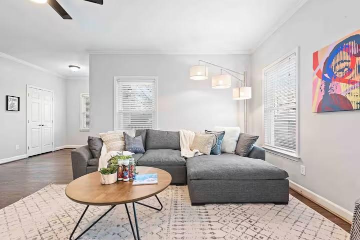 673 Windsor Street Southwest Atlanta, GA 30310 - Photo 10 of 29 a living room with furniture and wooden floor