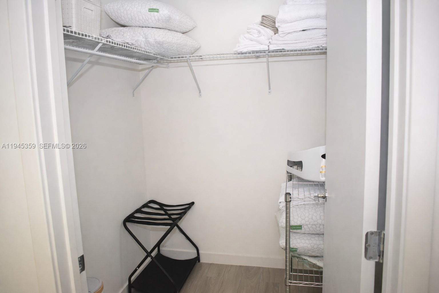 999 Southwest 1st Avenue, Unit 2214 Miami, FL 33130 - Photo 15 of 36 a view of a room with rack on the wall