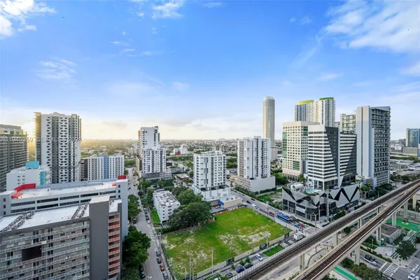 a view of a living room and entry way