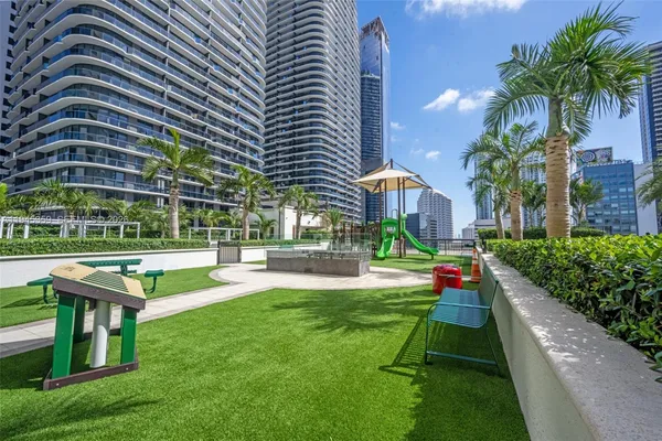 a city view with tall buildings and outdoor seating