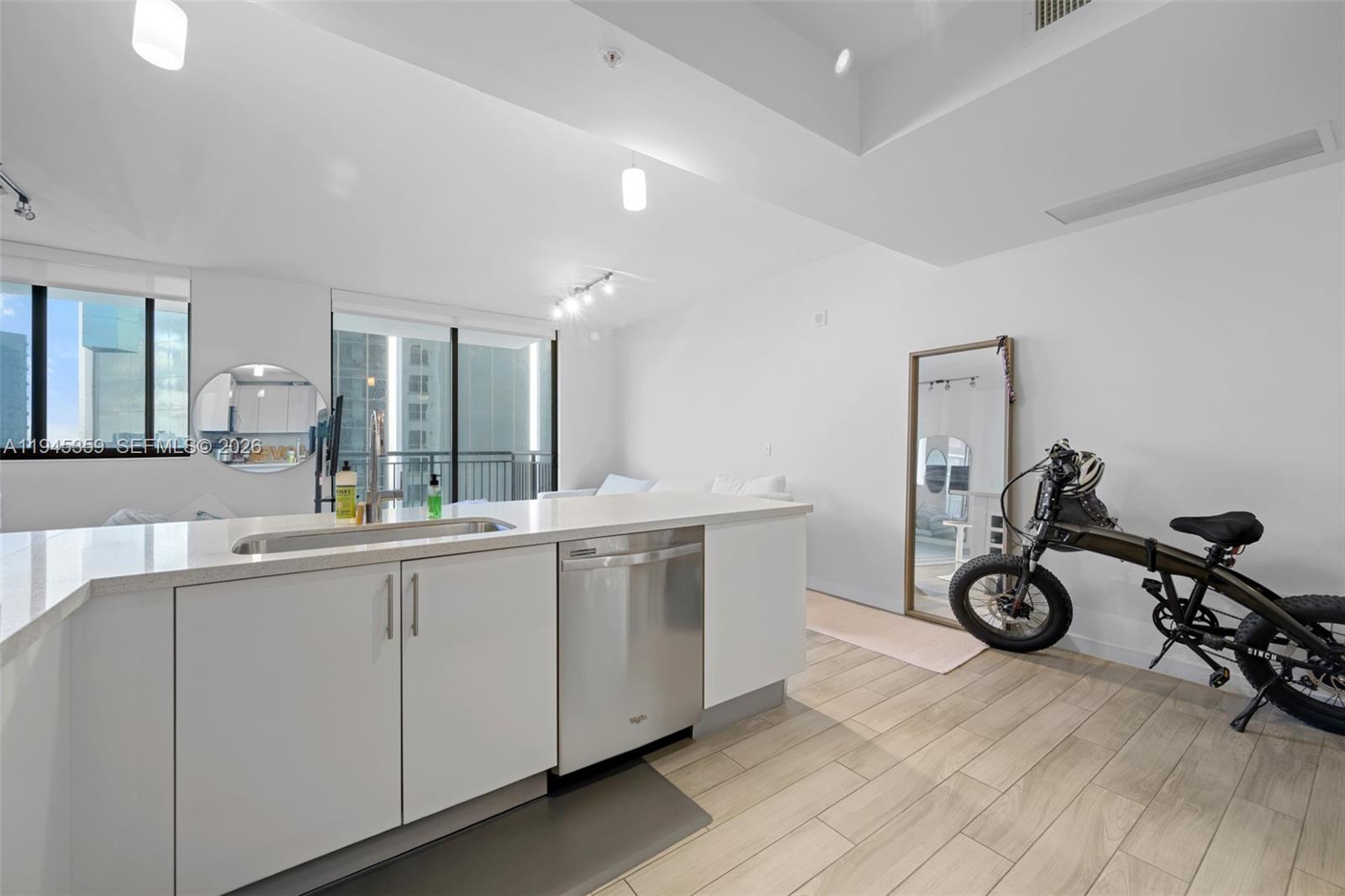 999 Southwest 1st Avenue, Unit 2214 Miami, FL 33130 - Photo 10 of 35 a view of a room with gym equipment