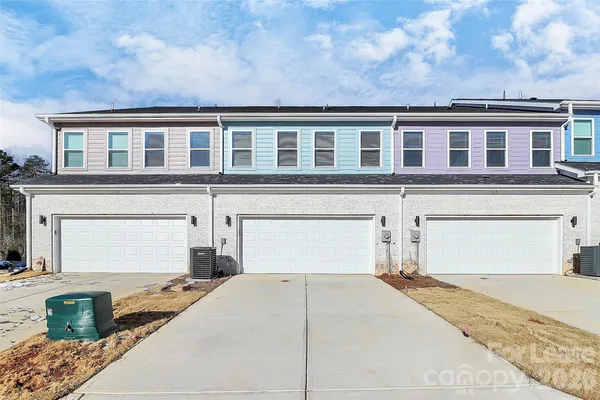 a front view of a house with a garage