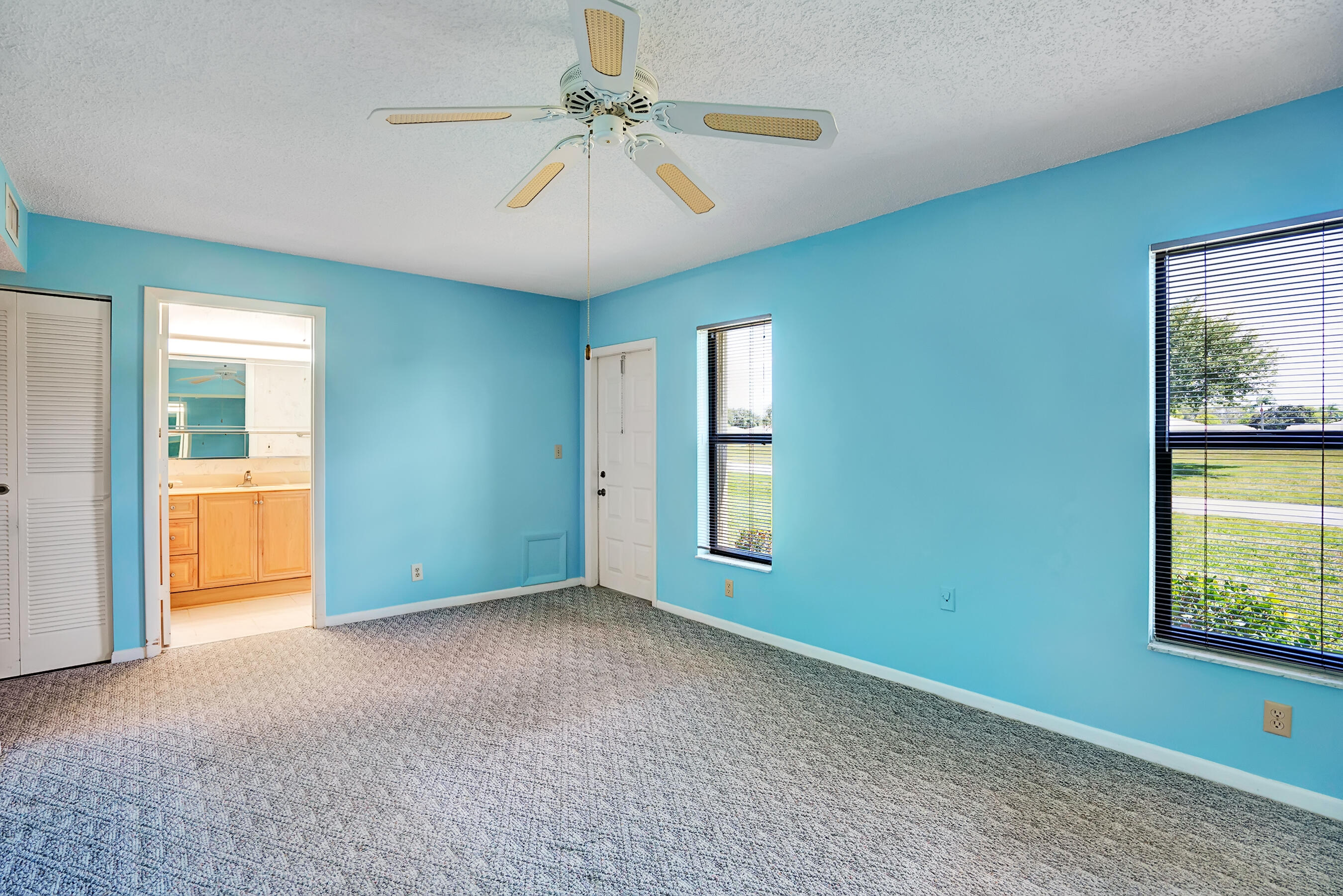 14100 Nesting Way, Unit D Delray Beach, FL 33484 - Photo 21 of 31 a view of an empty room with a window