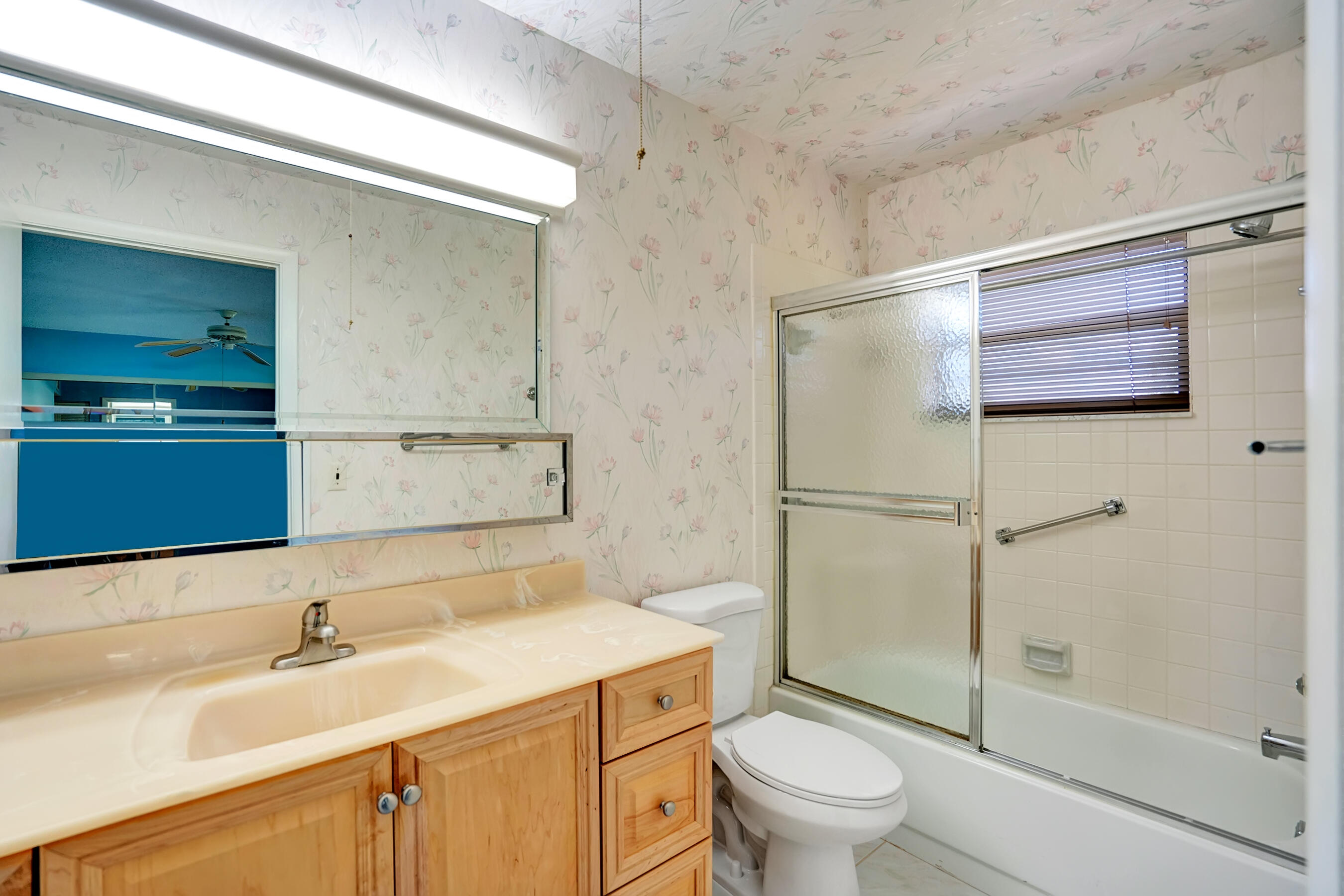 14100 Nesting Way, Unit D Delray Beach, FL 33484 - Photo 22 of 31 a bathroom with a sink and a washing machine