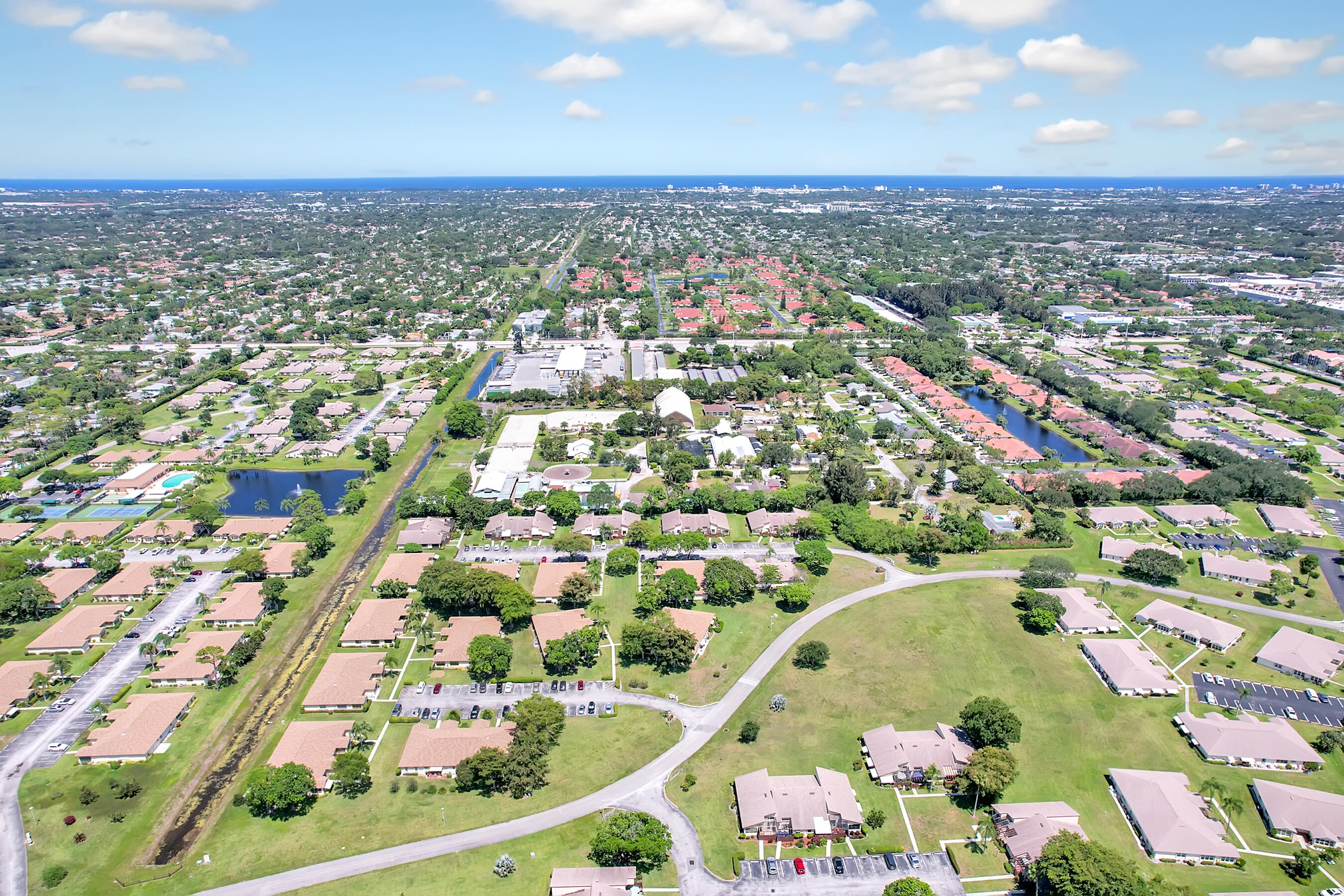 14100 Nesting Way, Unit D Delray Beach, FL 33484 - Photo 28 of 31 an aerial view of residential houses with outdoor space