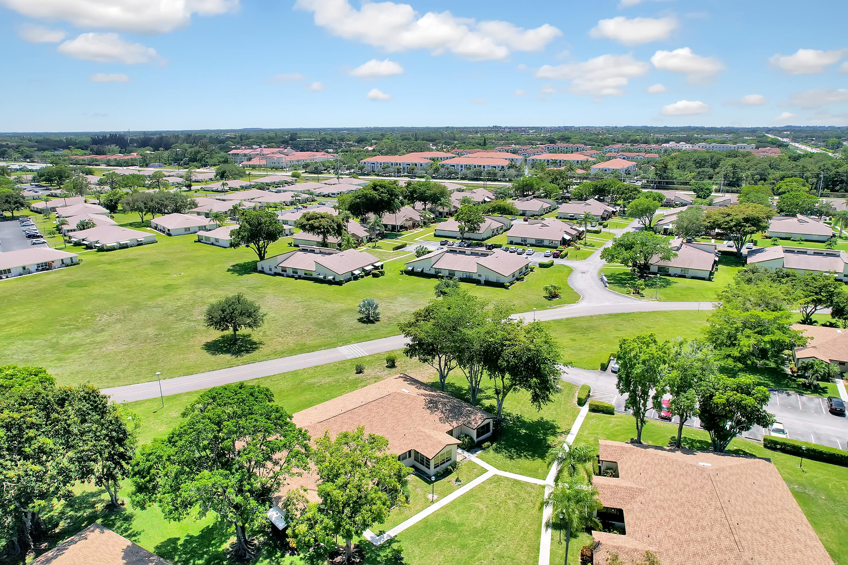 14100 Nesting Way, Unit D Delray Beach, FL 33484 - Photo 30 of 31 an aerial view of a houses with a yard
