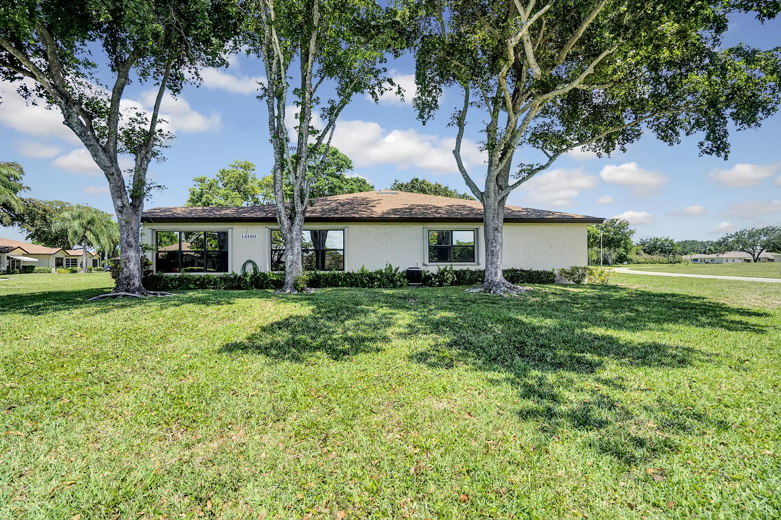 14100 Nesting Way, Unit D Delray Beach, FL 33484 - Photo 3 of 31 a front view of a house with garden