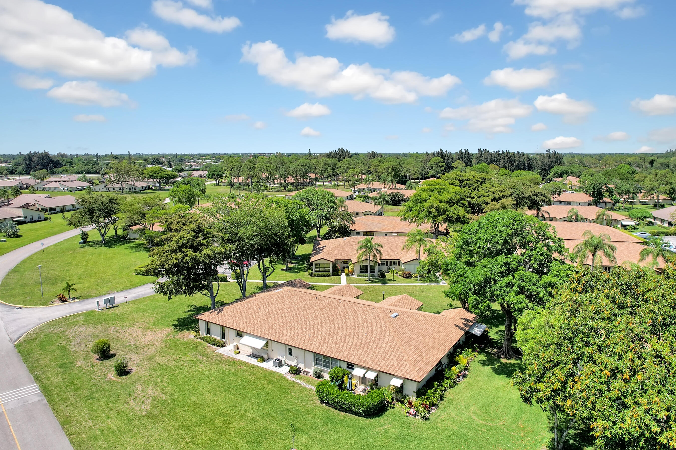 14100 Nesting Way, Unit D Delray Beach, FL 33484 - Photo 31 of 31 an aerial view of a house with yard swimming pool and outdoor seating