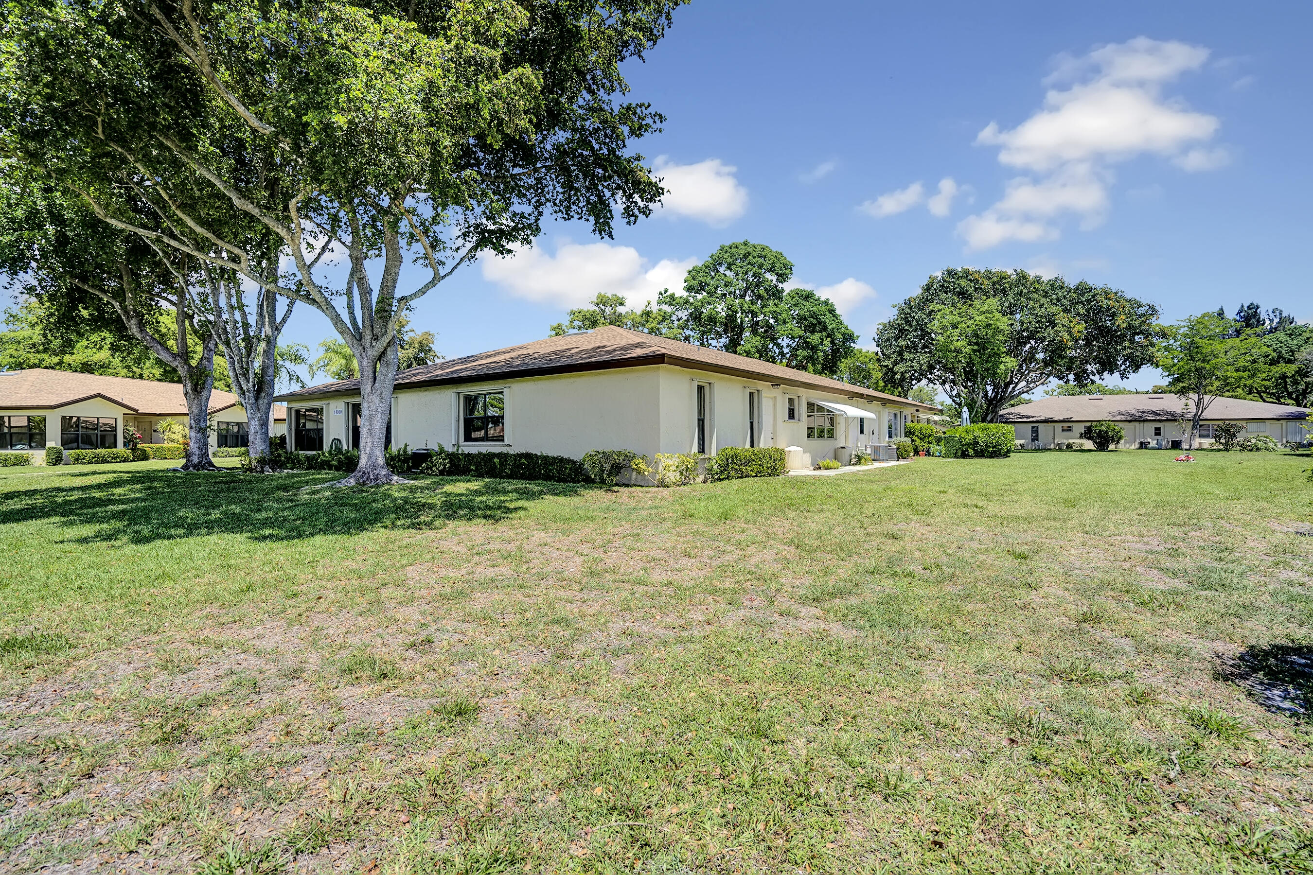 14100 Nesting Way, Unit D Delray Beach, FL 33484 - Photo 4 of 31 a house view with a garden space