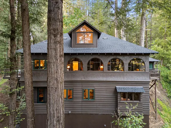 a view of a house with a tree