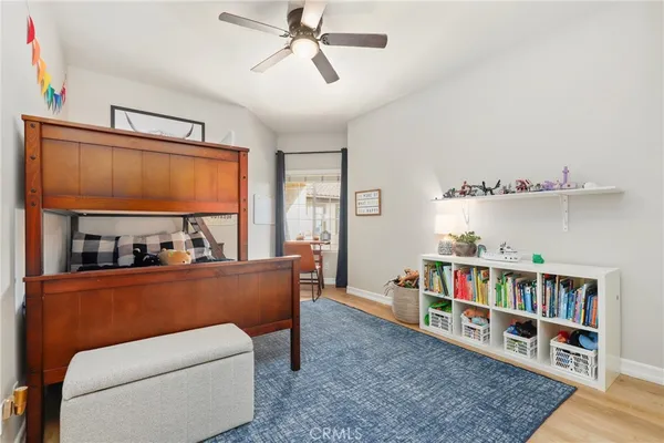 a living room with furniture and a book shelf