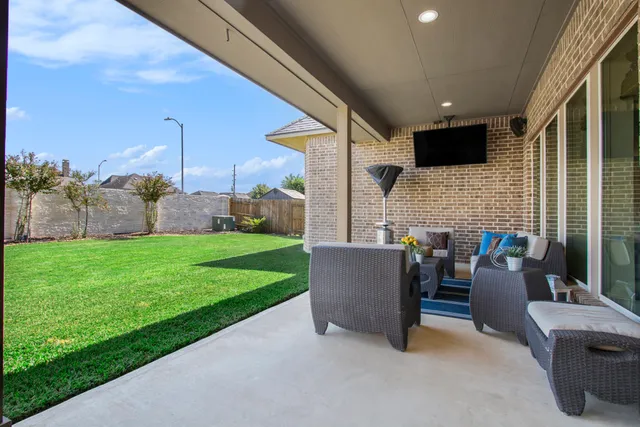 a view of yard with patio