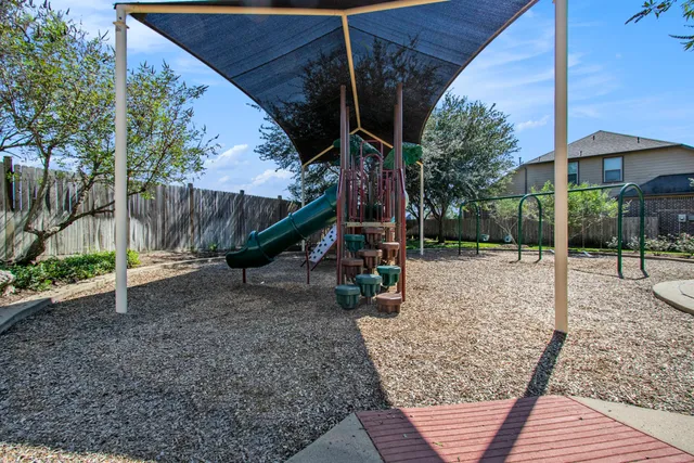 a view of a swimming pool with a yard