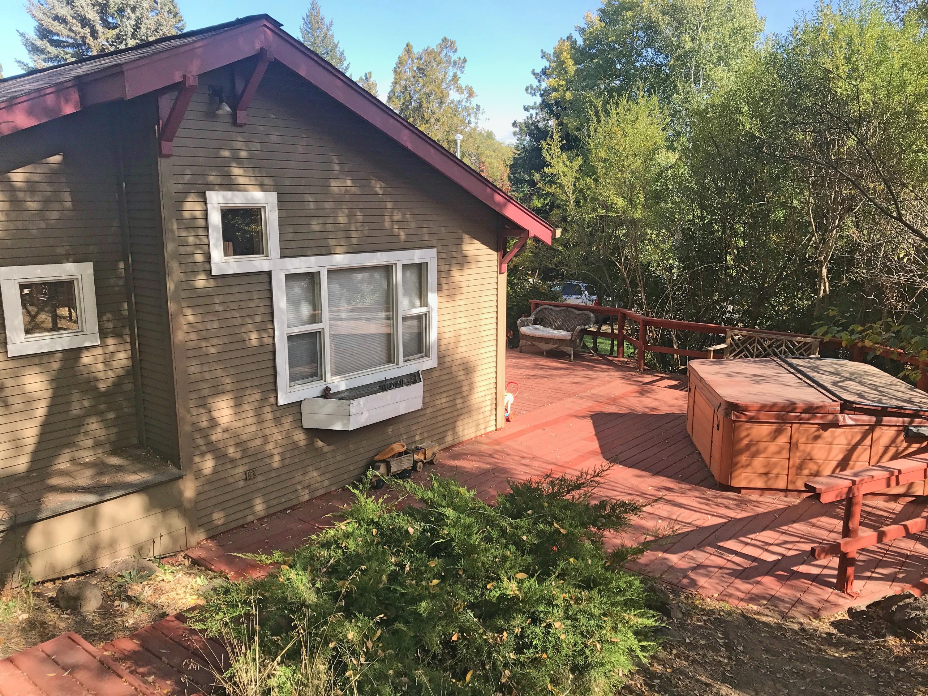1973 Northwest Awbrey Road Bend, OR 97703 - Photo 1 of 24 a view of a house with backyard and sitting area