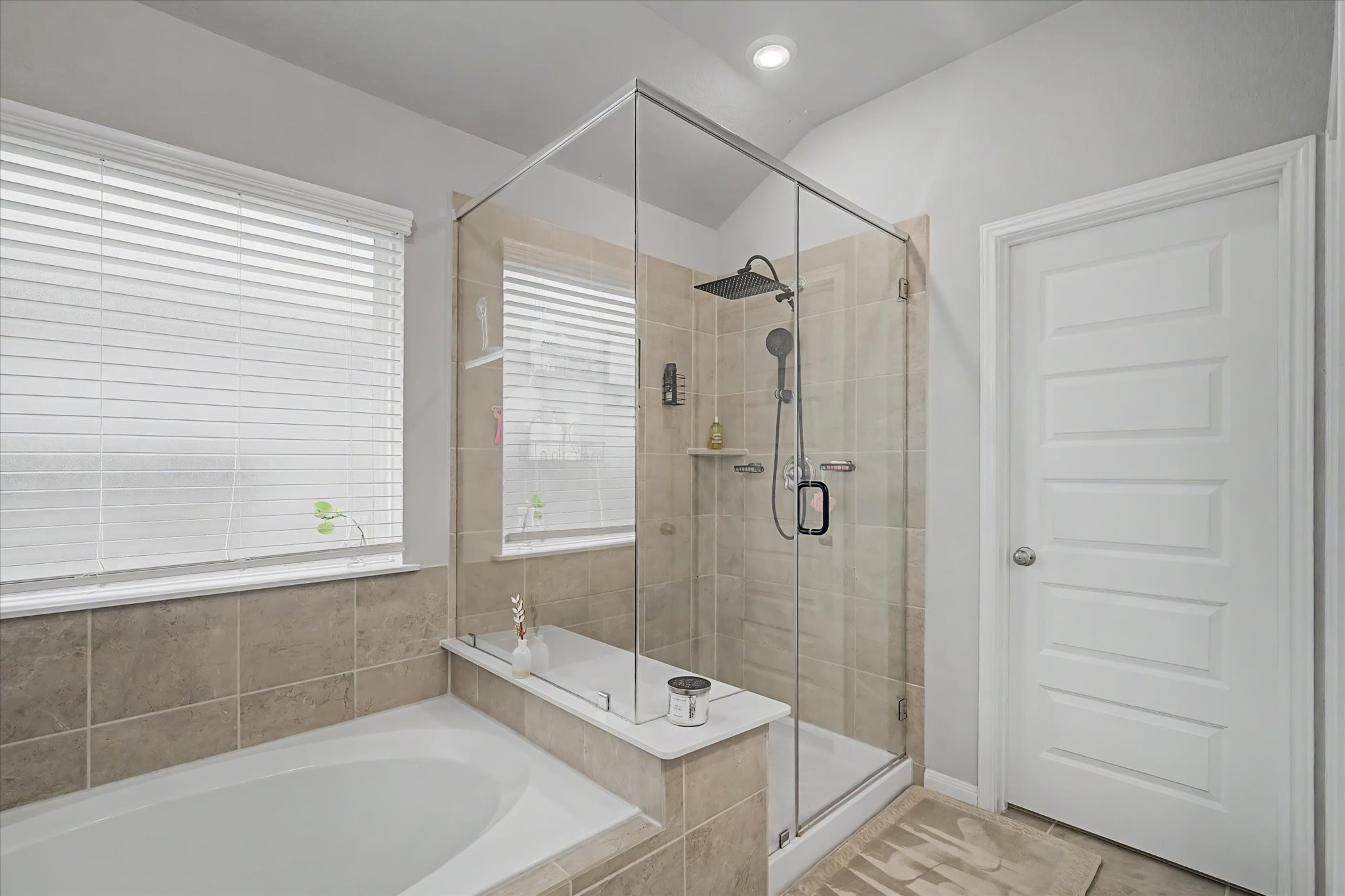 10842 Cliffs View Drive Iowa Colony, TX 77583 - Photo 23 of 47 Primary bathroom features a soaking tub and separate shower.