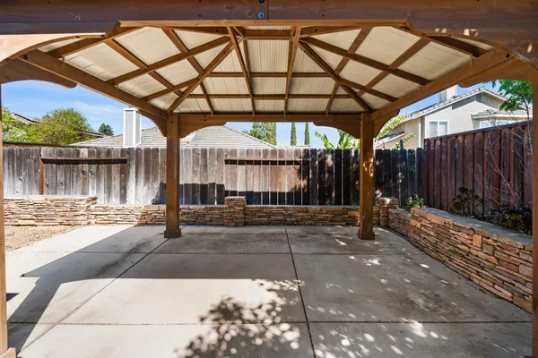 a view of a backyard with sitting area