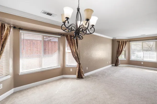 a kitchen with a refrigerator and a sink