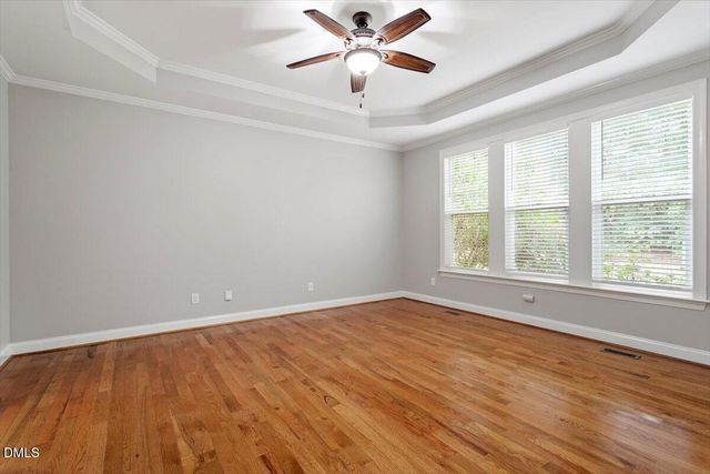 a view of a work space with wooden floor and furniture