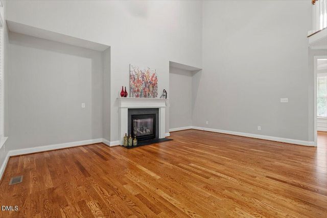 a view of kitchen with wooden floor and electronic appliances