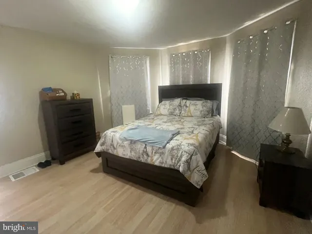 a kitchen with granite countertop a refrigerator stove and microwave